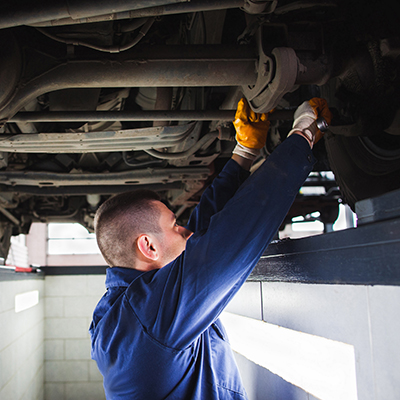 tech under car